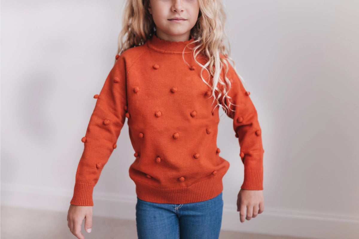 Rust Pom Pom Sweater